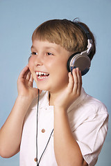 Image showing Boy listening music