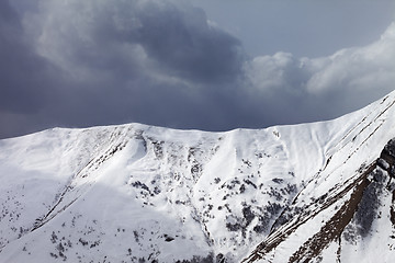 Image showing Snowy mountains and overcast sky