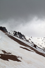 Image showing Snowy mountains in bad weather