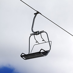 Image showing Chair-lift and cloudy sky