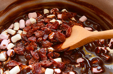Image showing Dried cranberries, marshmallows and melted chocolate