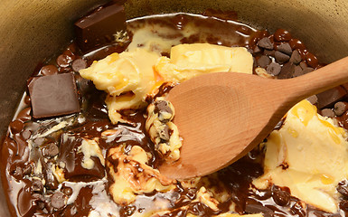 Image showing Melting butter and chocolate together in a pan