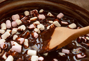 Image showing Mixing mini marshmallows into dark chocolate