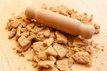 Image showing Crushing digestive biscuits with a rolling pin