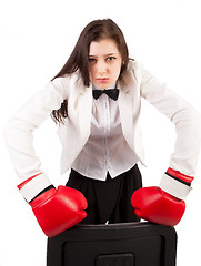 Image showing Young angry businesswoman in boxing gloves