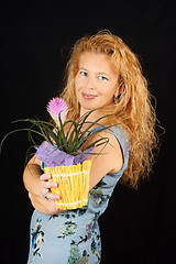 Image showing Blond woman with plant