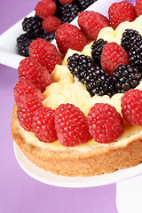 Image showing Custard tart with raspberries and blackberries