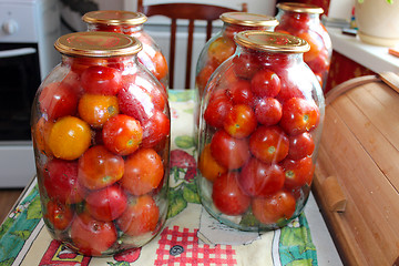 Image showing tomatos in jars prepared for preservation