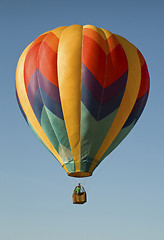 Image showing Hot-air balloon floating in a blue sky