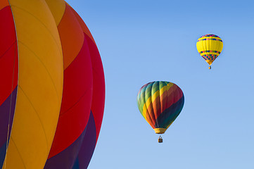 Image showing Airborne hot-air balloons with one in foreground
