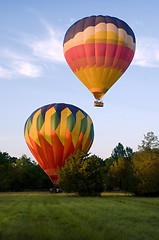 Image showing Two hot-air balloons taking off or landing