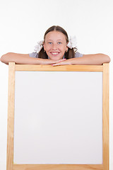 Image showing Girl and advertising stand