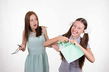 Image showing Schoolgirl rips his notebook