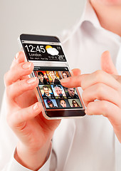 Image showing Smartphone with transparent screen in human hands.