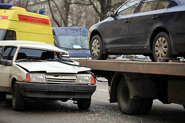 Image showing  incredible collision of a passenger car and a tow truck