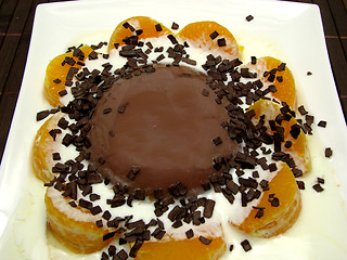 Image showing Chocolate pudding with yoghurt, sliced tangerines and chocolate