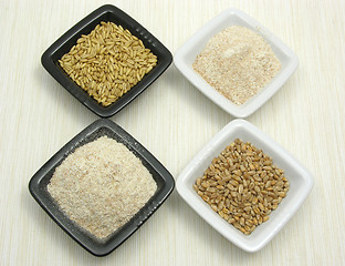 Image showing Bowls of chinaware with oat, porridge and meal 