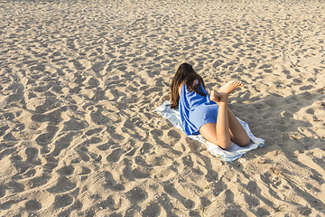 Image showing Woman on a sandy beach 