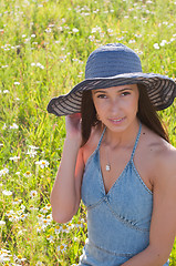 Image showing Beautiful woman on the flowers field