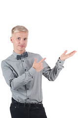 Image showing Man in shirt and bow-tie pointing with his fingers