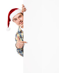 Image showing Young man in Santa hat