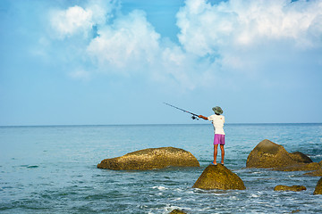 Image showing Local man fishing with rod