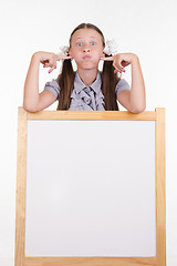 Image showing Teen stands at the blackboard for advertising