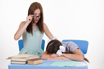 Image showing Trainee fell asleep in front of the teacher