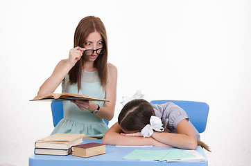 Image showing The teacher saw sleeping student