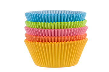 Image showing Colorful empty muffin cups on a white background 