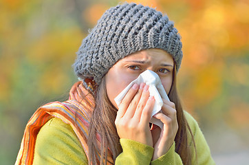 Image showing girl blowing nose