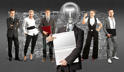 Image showing Business Team With Lamp Head