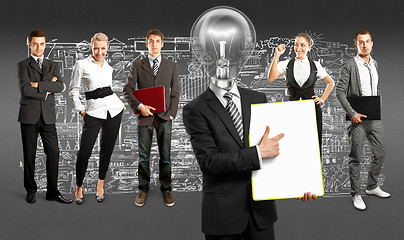 Image showing Business Team With Lamp Head