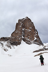 Image showing Hikers at snowy cloudy mountains