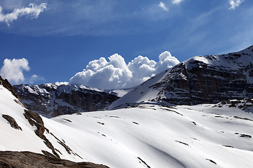 Image showing Snow rocks and cloudy blue sky