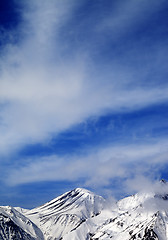 Image showing Winter snowy mountains and sky with clouds at nice day