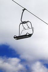 Image showing Chair-lift and cloudy sky