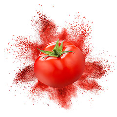 Image showing Tomato with red powder explosion isolated on white