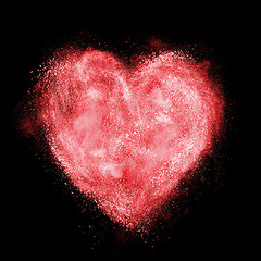 Image showing red heart made of white powder explosion isolated on black