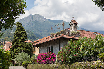 Image showing Beautiful house with green garden and flowers in Italy