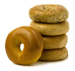 Image showing Stack of Four Bagels with OneLeaning on the Side