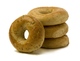 Image showing Stack of Three Bagels with One Leaning on the Side 