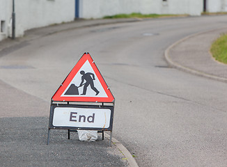 Image showing Triangular construction sign standing on footpath