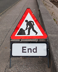 Image showing Triangular construction sign standing on footpath