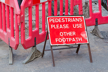 Image showing Construction sign standing on footpath