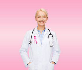 Image showing doctor with stethoscope, cancer awareness ribbon