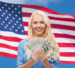 Image showing smiling young woman with us dollar money