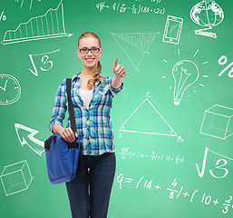 Image showing smiling student girl showing thumbs up