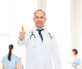 Image showing smiling male doctor with stethoscope