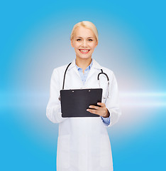 Image showing smiling female doctor with clipboard